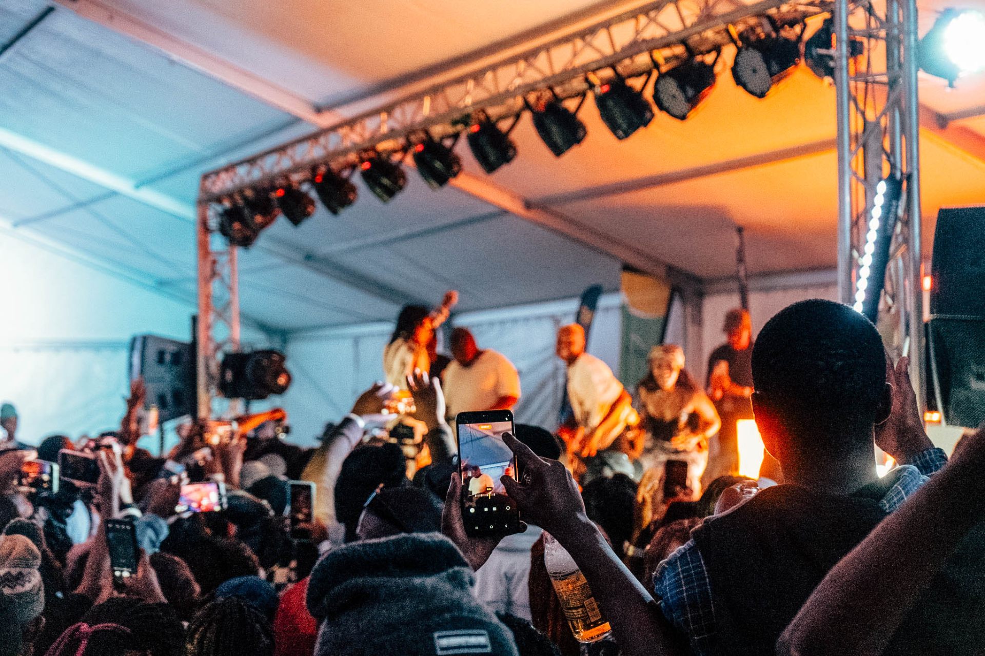 Festival crowd under stage lights